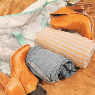subtl beauty packing gym bag like a pro with jeans shirt and shoes